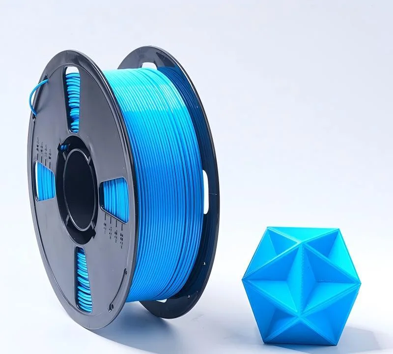 Blue PETG filament spool with printed test model